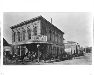 Exterior view of the Lindenfeld & Co. Liquor Store on the southwest corner of Main Street and Third Street, Los Angeles, ca.1884