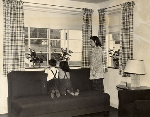 [Donald Sanchez, Frances Bonnici and Mrs. Alice Stinchcomb in an apartment at the Sunnydale housing project]