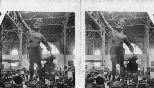 Williams, the Crusher and pulverizer man. The coal crusher. St. Louis World's Fair, Missouri. [ sign reads - GREAT IRON MAN - VULCAN GOD OF FIRE AND METALS.]