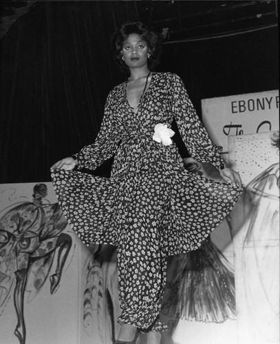Ebony Fashion Fair model posing on a runway