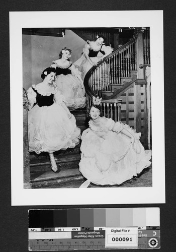 Four women in ballet costumes on stairway at The Bivouac