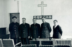 A small group of christians with pastor Ku in the middle in the Jinzhou Church, 1986