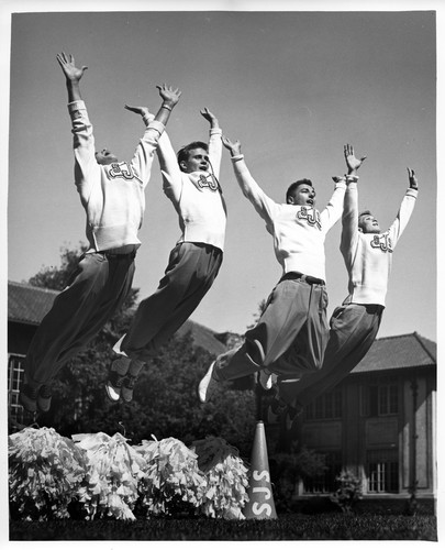 Action Shot of Four Male San Jose State College Cheerleaders
