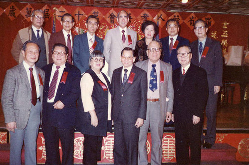 Group photo inside of a restaurant, Lily Lum Chan is in the center of the front row