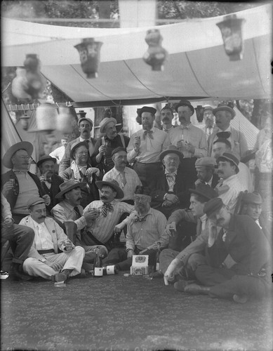 Group portrait of men drinking, Bohemian Grove. [negative]