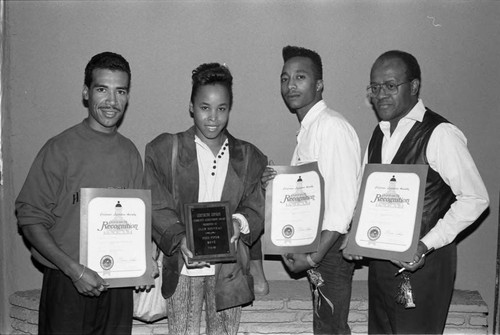 Club Nouveau posing with awards at the Pied Piper nightclub, Los Angeles, 1989