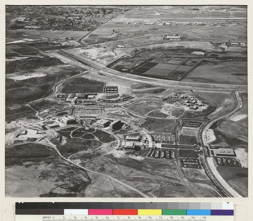 Irvine campus. Classes opened in fall 1965. Academic buildings partly ring campus park from which future structures will radiate in a spoke-like fashion. Completed buildings are: Science Lecture Hall, Natural Science, Fine Arts, Humanities-Social Science, The Commons, and Administration-Library Building. To right of center are the Mesa Court residence halls