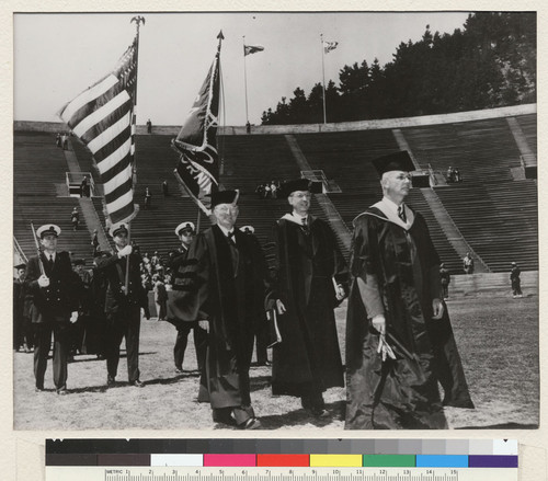 Berkeley campus. Led by Edwin C. Voorhies, University marshal, Harry Truman, President of the United States (left) and University President Sproul, the academic procession enters the California Memorial Stadium for the commencement exercises of 1948