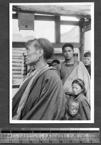 Group under wooden structure, Tibet, China, ca.1941