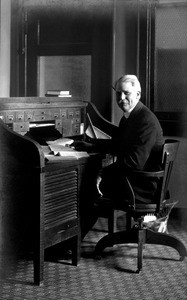 Registrar R. C. King at his desk