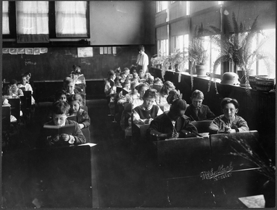 Students seated at desks in classroom