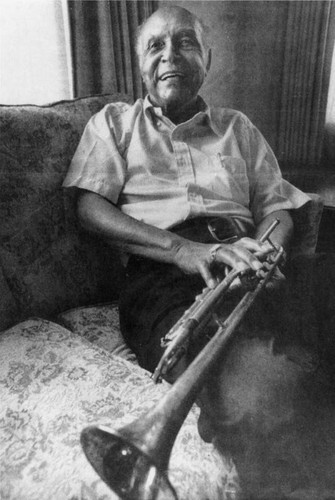 Arvant Benjamin with his trumpet