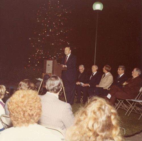 M. Norvel Young speaking at tree lighting ceremony, 1980