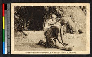 Woman kneading with her child on her back, Congo, ca.1933