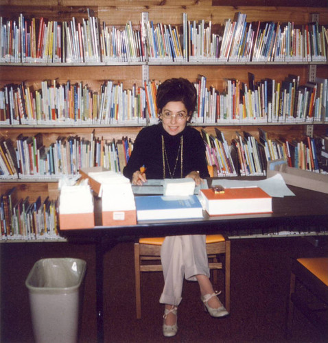 Diana De Leon doing inventory before University Park Library opened, 1975