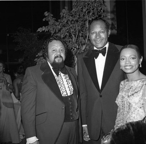 Tom Bradley posing with Florence LaRue and Ron Townson at an event in his honor, Los Angeles, 1974