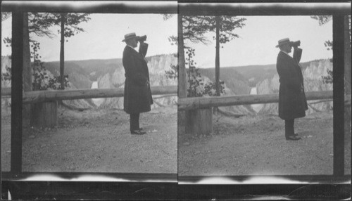 President at Inspiration Point overlooking Upper Falls that has a drop of 308 ft. President Coolidge is using field glasses