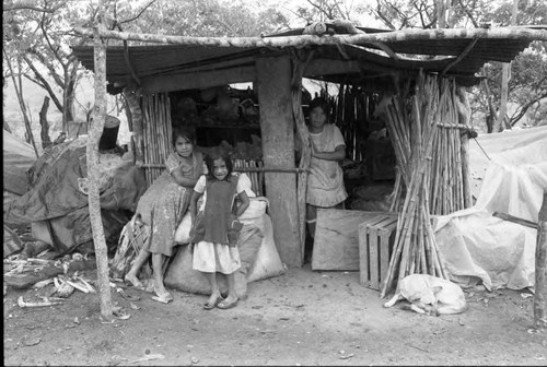Refugee woman in a hut of logs, Chiapas, 1983