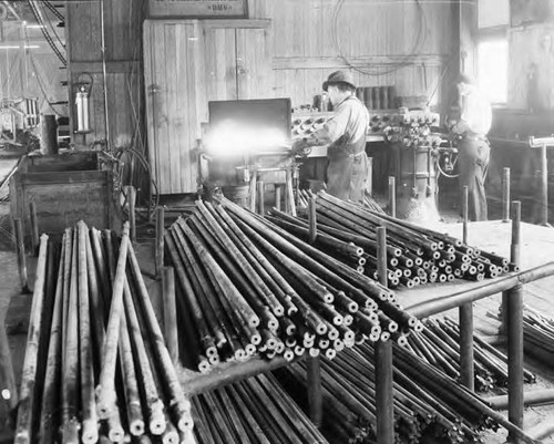 Blacksmith sharpening drills to be used in construction of tunnel