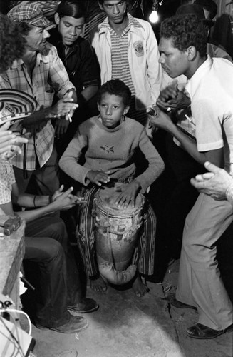 Boy playing the conga drum, Barranquilla, Colombia, 1977
