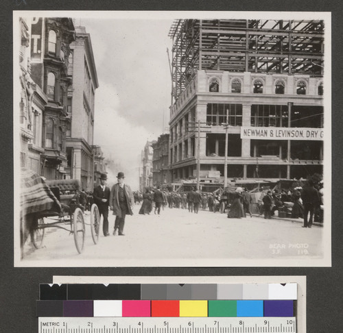 [View down Stockton St. near Union Square with fire in distance.]