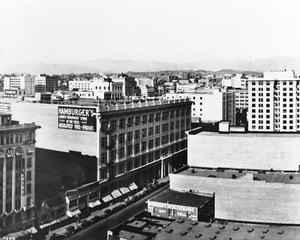 In Downtown Los Angeles, a view from above facing north on South Broadway at West Eighth Street showing Hamburger's Department Store