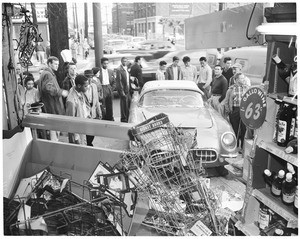Car into store at Venice Boulevard and Grand Avenue, 1956