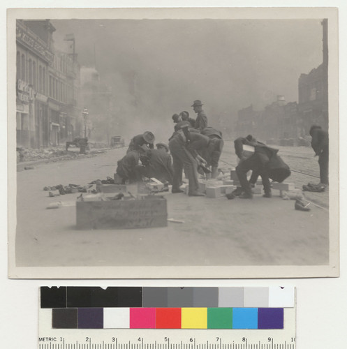 [Looters? Soldiers and police sorting through shoe boxes. 1100 block Market St.]