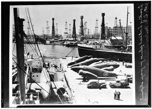Lockheed airplanes being loaded for foreign shipment at Los Angeles Harbor