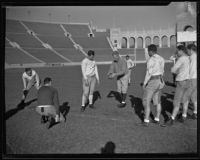 Coach Howard Jones instructing his team at the Coliseum, Los Angeles, 1925-1939