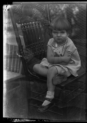 Portrait of girl sitting in chair