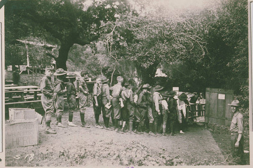 Boy Scouts lined up at the camp's makeshift library in Temescal Canyon, Calif