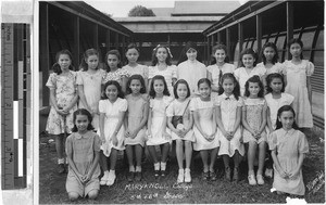 Group portrait of Maryknoll College fifth and sixth grade girls with Sr. Robert Marie, MM, Pasay, Philippines, ca. 1945/1950
