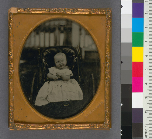 [Baby in a stroller (smiling); possibly Frank Mattison]