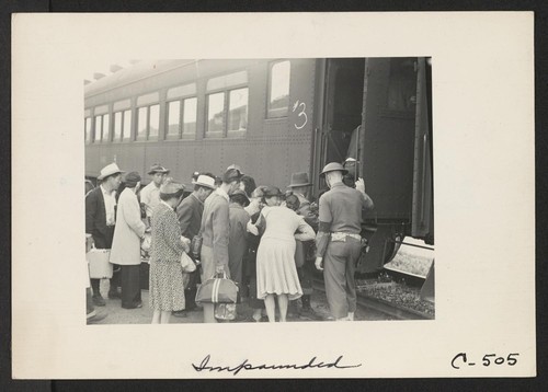 The train is about to depart which will take these evacuees of Japanese ancestry from this rich agricultural district to the Merced Assembly Center, about 125 miles away. Many leave close friends behind. Photographer: Lange, Dorothea Woodland, California
