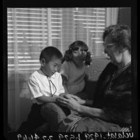 Ora Sauder with her two adopted Korean children, Anaheim, Calif., 1964