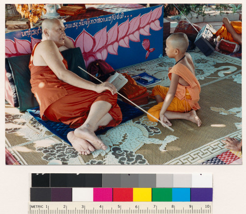 Lao Buddhist monk with child