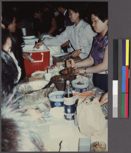 Women making and selling food at an event, Oakland, California