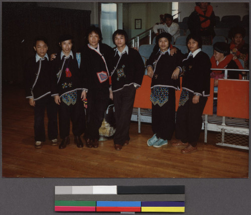 Young Mien men in traditional clothing