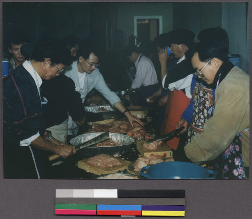 Men preparing meat for a gathering, Oakland, California