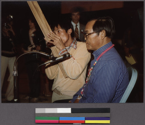 Man playing musical instrument at New Year festival