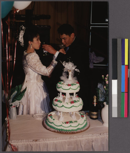 Lao bride and groom toasting each other, Northern California