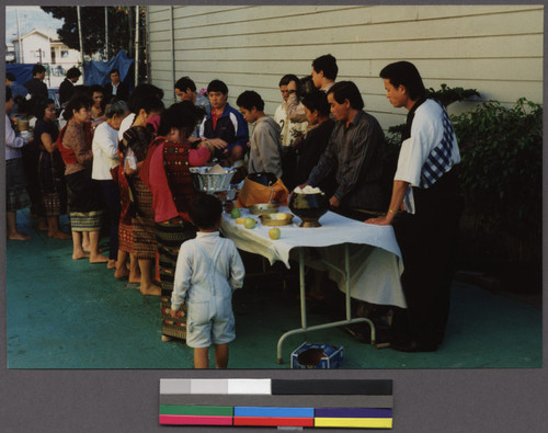 Making food offerings at a Lao temple in West Oakland