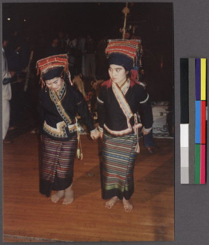 Two dancers in costume at New Year's gathering