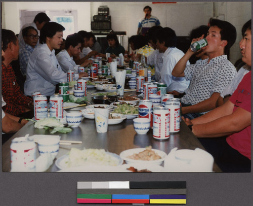 Men sharing a meal after a temple ceremony, Sacramento, California