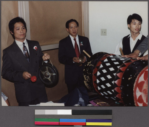 Three Lao men with musical instruments