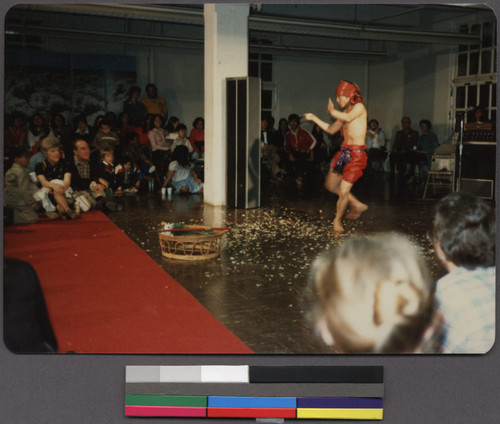 Man performing the sand dance at a Lao New Year's party, San Francisco