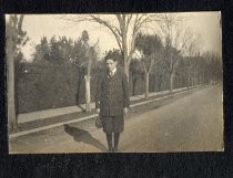 Young man standing on road