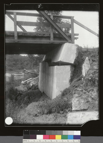 Highway bridge abutment at Chittenden underthrust by the disturbance of the alluvial ground on which it rested