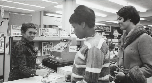 Students making a purchase at the Bookstore, 1968-69